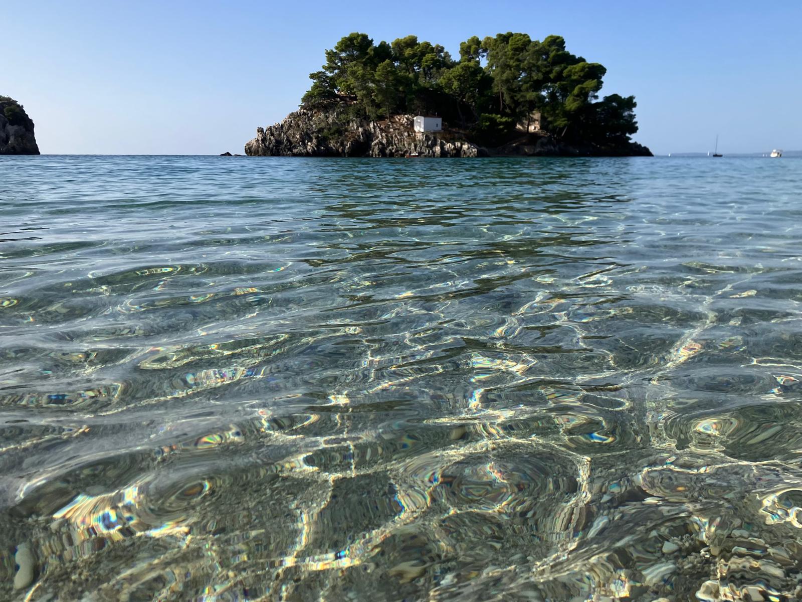 The town and the islet from the sea, in the late light.